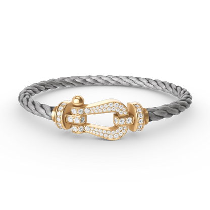 [Joyas Regalia]Pulsera de herradura grande con diamantes en oro.
