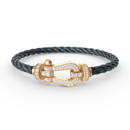 [Joyas Regalia]Pulsera de herradura grande con diamantes en oro.