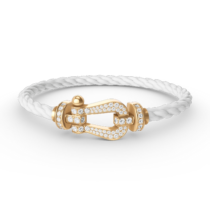 [Joyas Regalia]Pulsera de herradura grande con diamantes en oro.