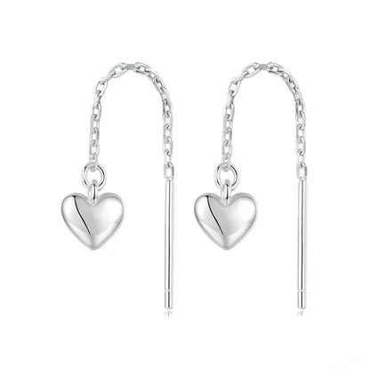 Boucles d'oreilles pendantes simples en forme de cœur avec longs pompons