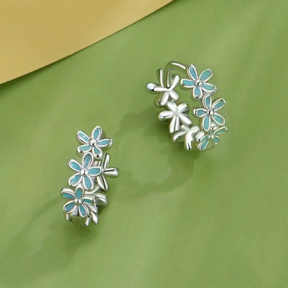 Boucles d'oreilles créoles en guirlande vert menthe et fleurs en émail