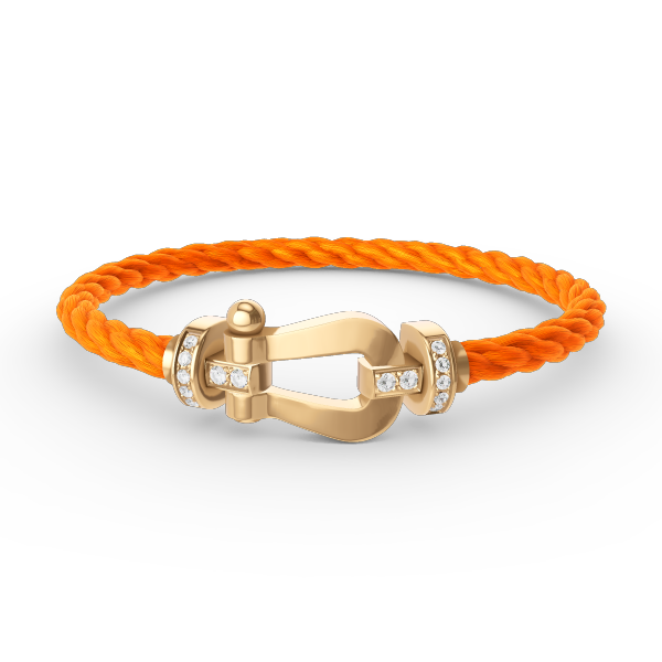 [Joyas Regalia]Pulsera de herradura grande con medio diamante en oro.