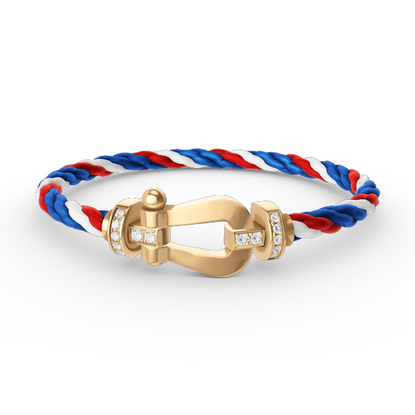 [Joyas Regalia]Pulsera de herradura grande con medio diamante en oro.