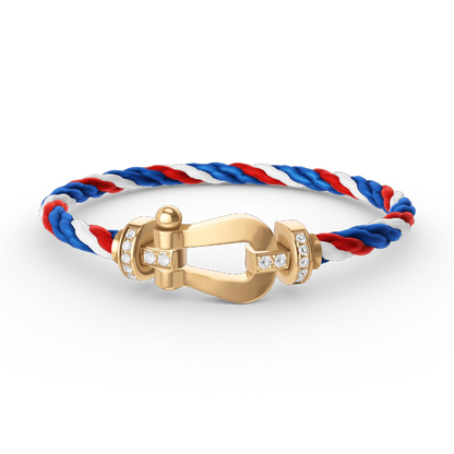 [Joyas Regalia]Pulsera de herradura grande con medio diamante en oro.