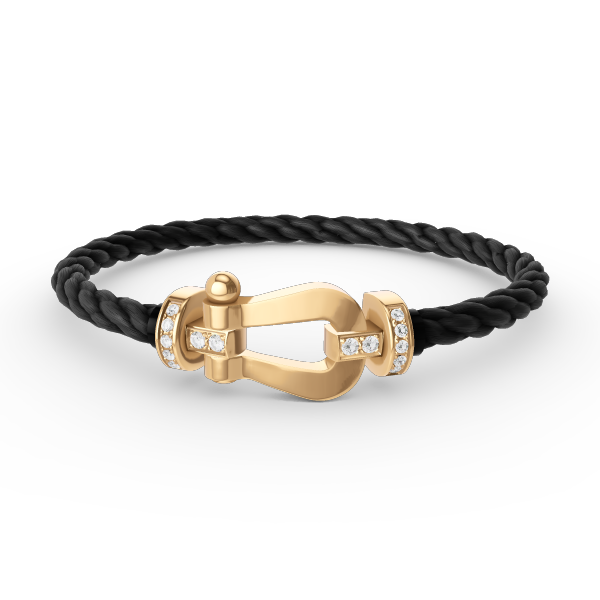 [Joyas Regalia]Pulsera de herradura grande con medio diamante en oro.