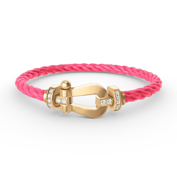 [Joyas Regalia]Pulsera de herradura grande con medio diamante en oro.