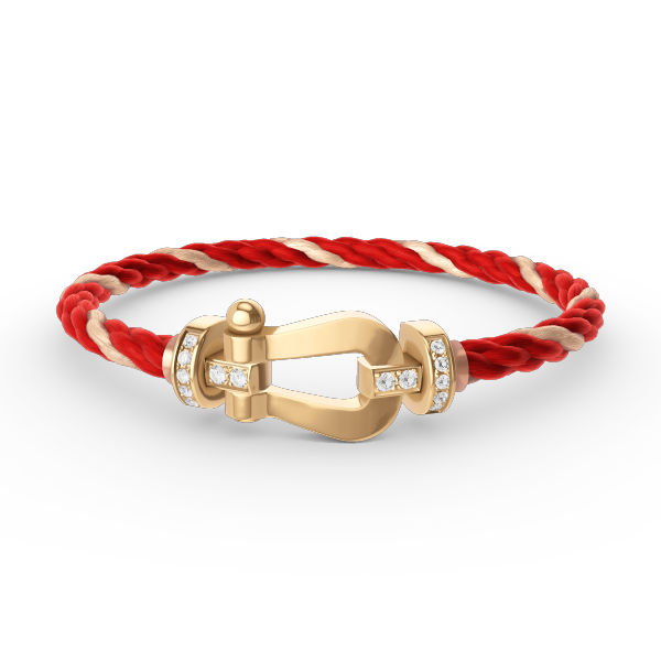[Joyas Regalia]Pulsera de herradura grande con medio diamante en oro.
