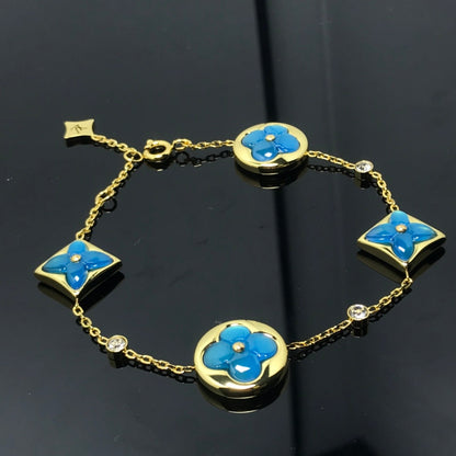 [Joyas Regalia]PULSE AZUL CON 4 MOTIVOS DE ESTRELLA Y SOL