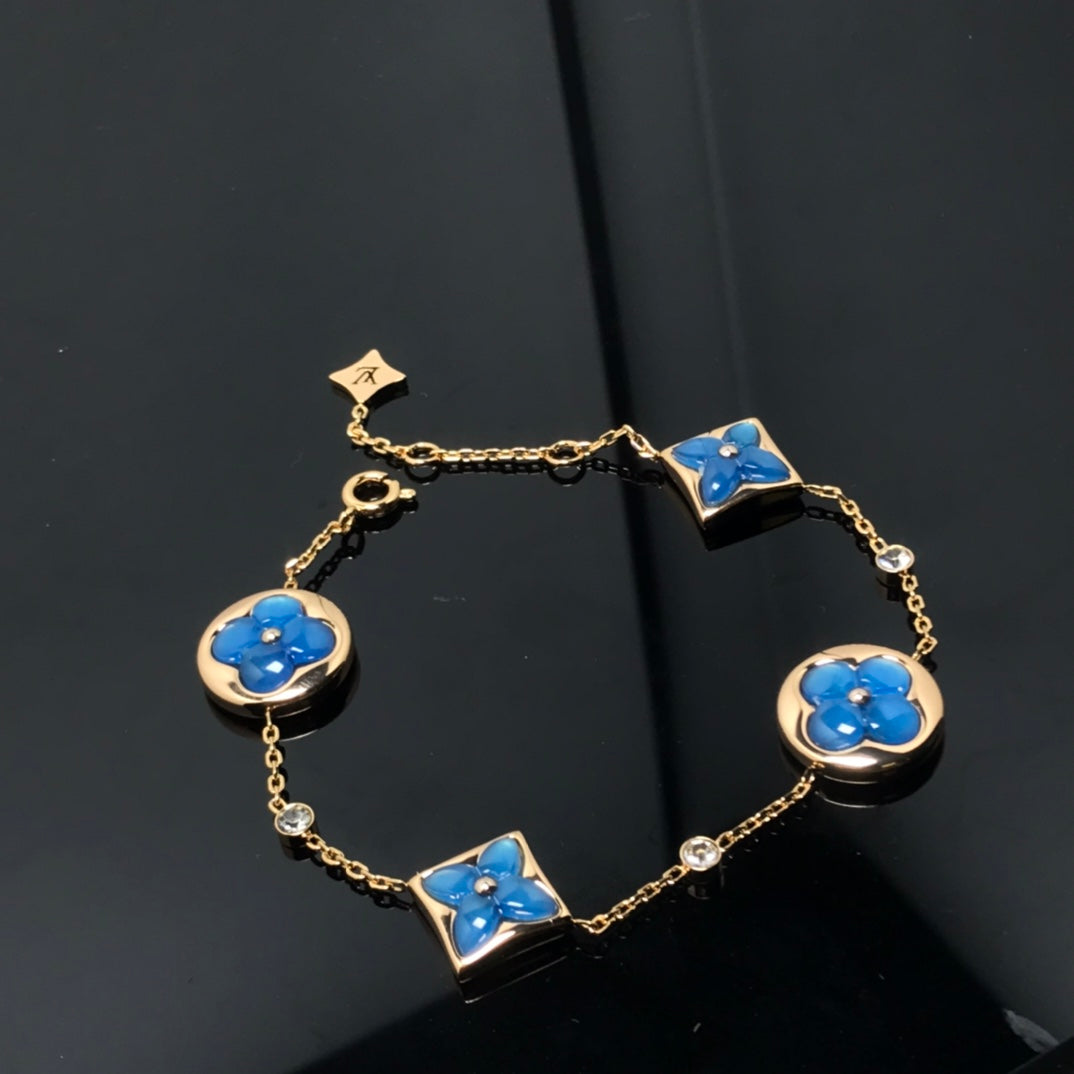 [Joyas Regalia]PULSE AZUL CON 4 MOTIVOS DE ESTRELLA Y SOL