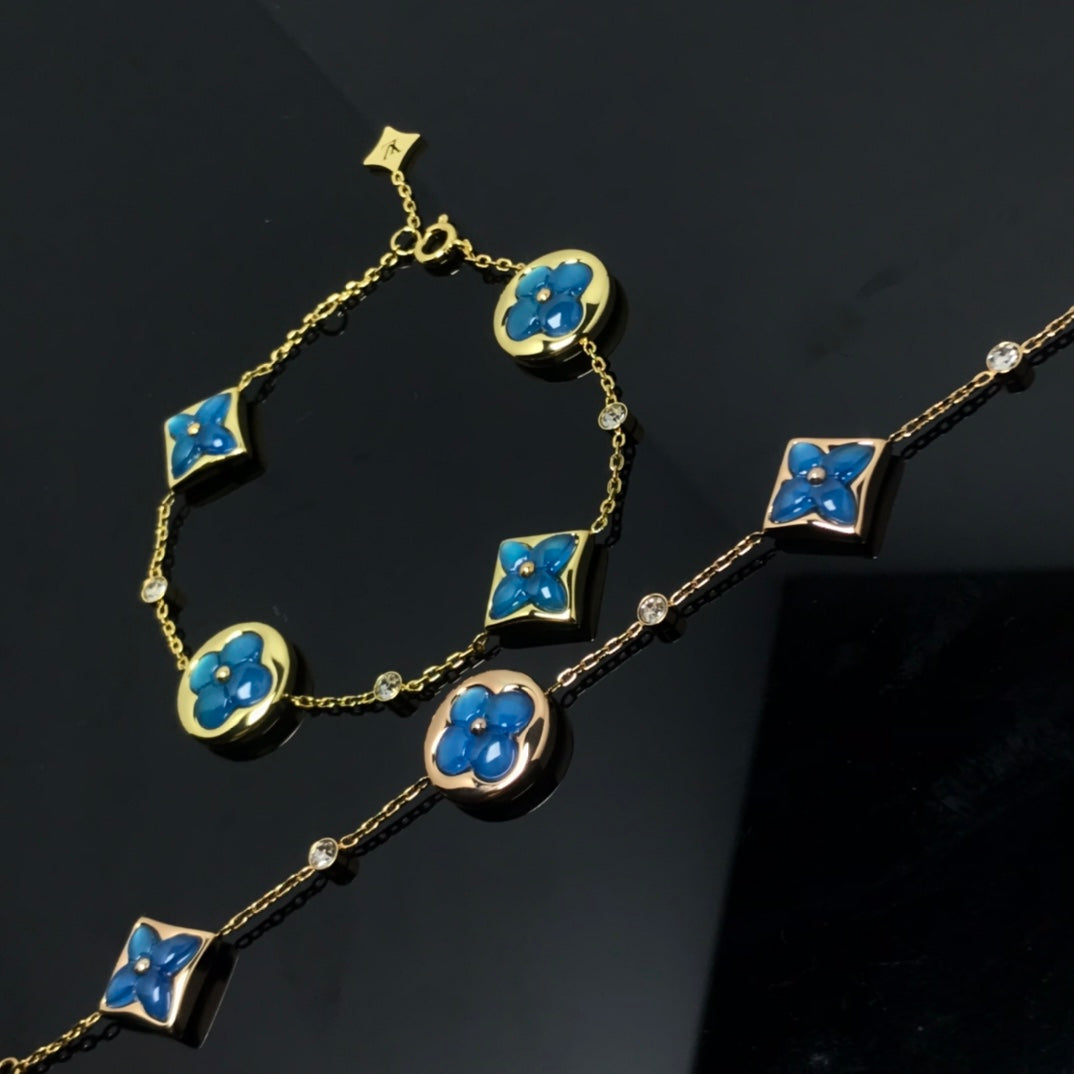 [Joyas Regalia]PULSE AZUL CON 4 MOTIVOS DE ESTRELLA Y SOL