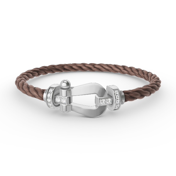 [Joyas Regalia]Pulsera de herradura grande con medio diamante en plata.