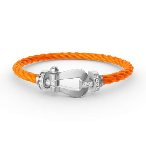 [Joyas Regalia]Pulsera de herradura grande con medio diamante en plata.