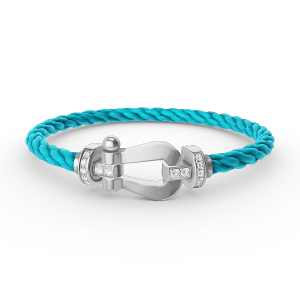 [Joyas Regalia]Pulsera de herradura grande con medio diamante en plata.