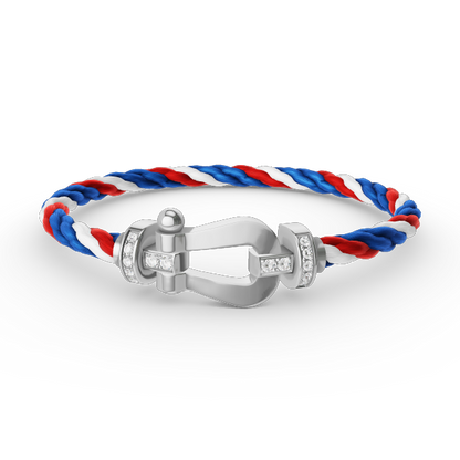 [Joyas Regalia]Pulsera de herradura grande con medio diamante en plata.