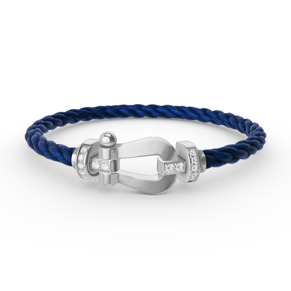 [Joyas Regalia]Pulsera de herradura grande con medio diamante en plata.
