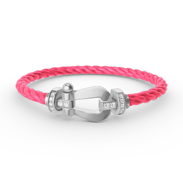 [Joyas Regalia]Pulsera de herradura grande con medio diamante en plata.