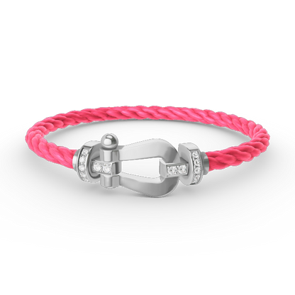 [Joyas Regalia]Pulsera de herradura grande con medio diamante en plata.