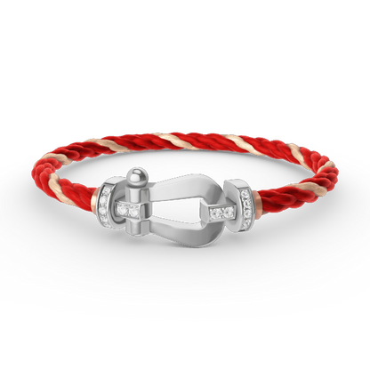[Joyas Regalia]Pulsera de herradura grande con medio diamante en plata.