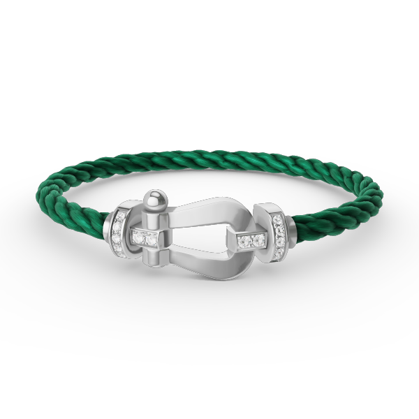 [Joyas Regalia]Pulsera de herradura grande con medio diamante en plata.