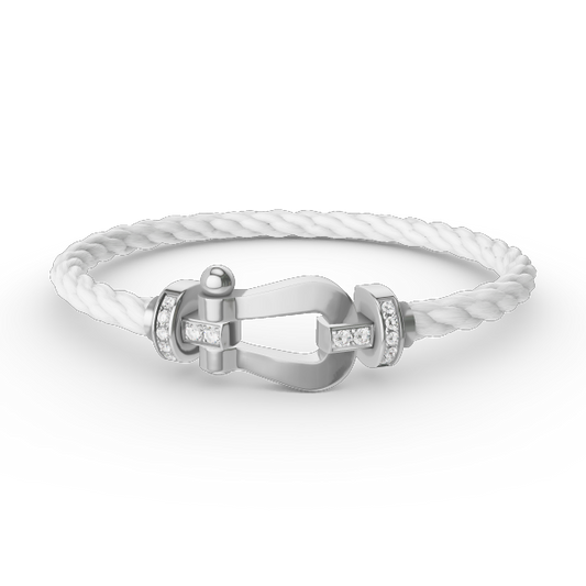 [Joyas Regalia]Pulsera de herradura grande con medio diamante en plata.